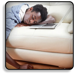 Guy Sleeping On Couch Holding Laptop