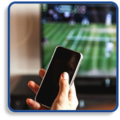 Hand Holding a Smartphone - Television Showing a Tennis Match