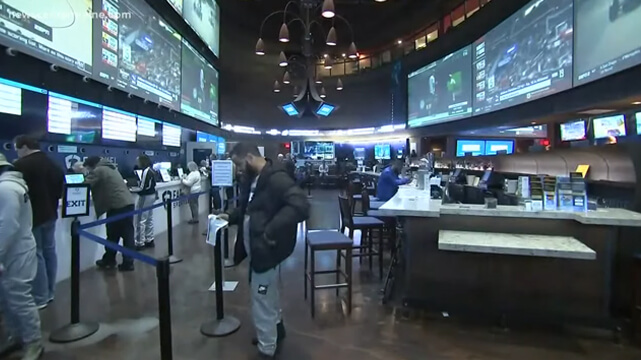 People Betting at a Brick and Mortar Sportsbook