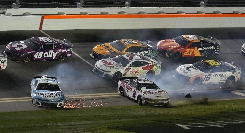Photo of the 2024 Daytona 500, with two cars sliding after crashing.