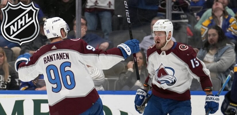 Photo of Colorado Avalanche players celebrating after scoring against St. Louis Blues.