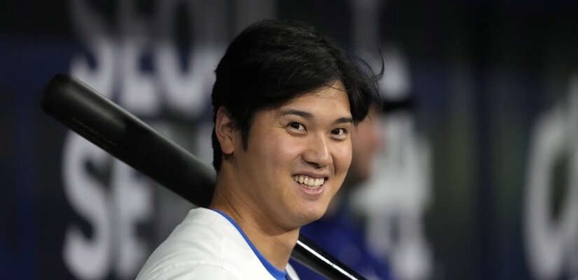 Photo of Shohei Ohtani standing with a baseball bat.