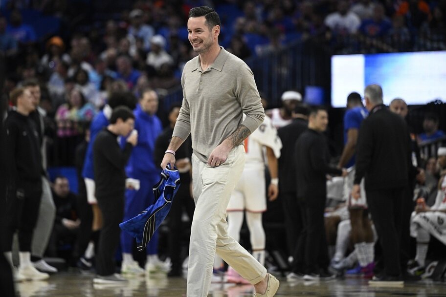 JJ Redick walks on the court for his jersey retirement in Orlando