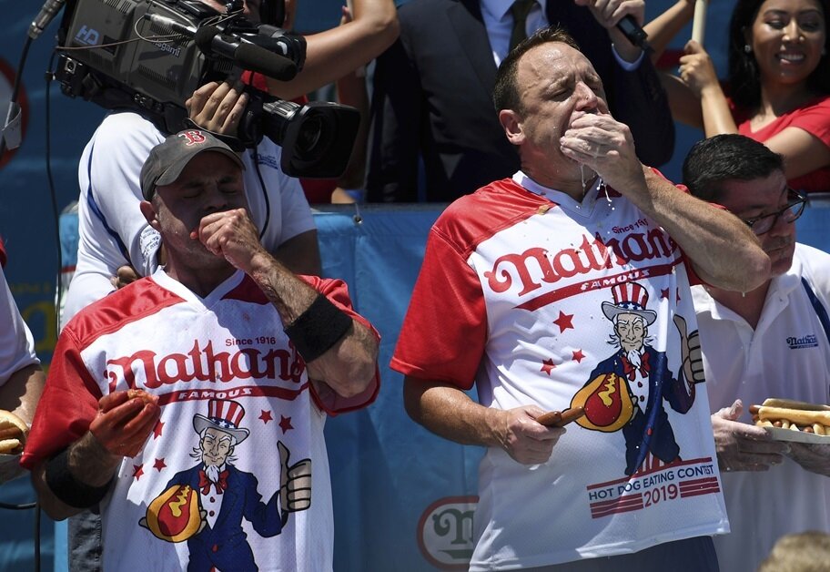 Geoffrey Esper and Joey Chestnut compete in Nathan's Hot Dog Eating Contest