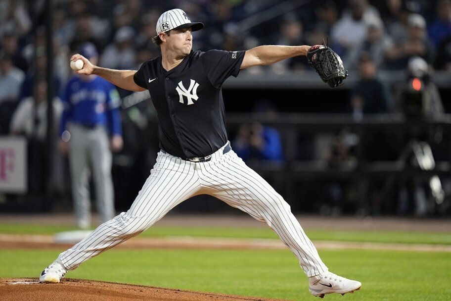 The New York Yankees' Gerrit Cole makes a pitch during spring training.