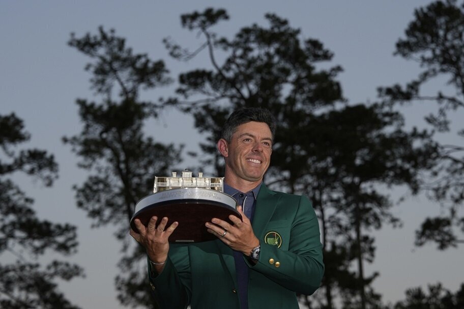 Rory McIlroy poses with the Masters trophy.