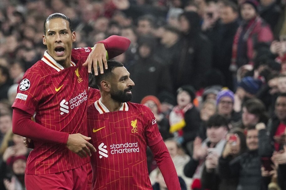 Virgil van Dijk and Mo Salah celebrate a goal for Liverpool.