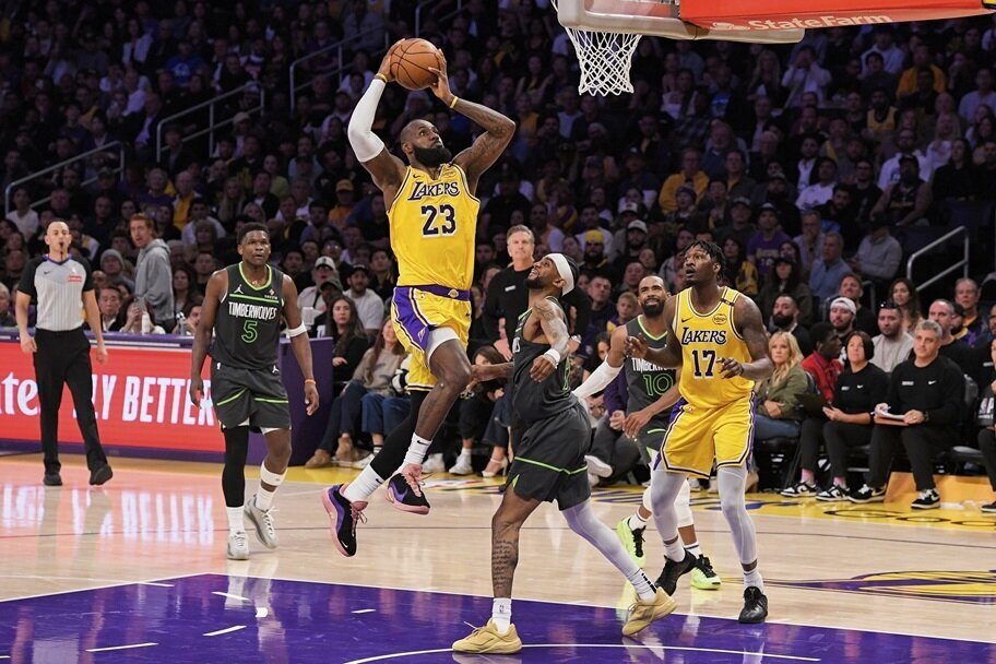 LeBron James goes for a dunk against Minnesota.