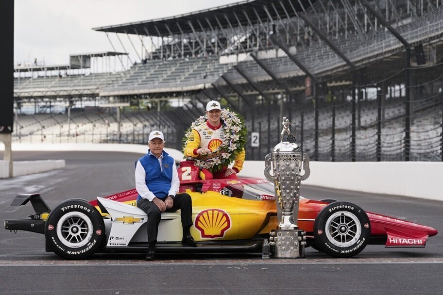 Roger Penske and Josef Newgarden pose after winning the Indy 500 in 2024.