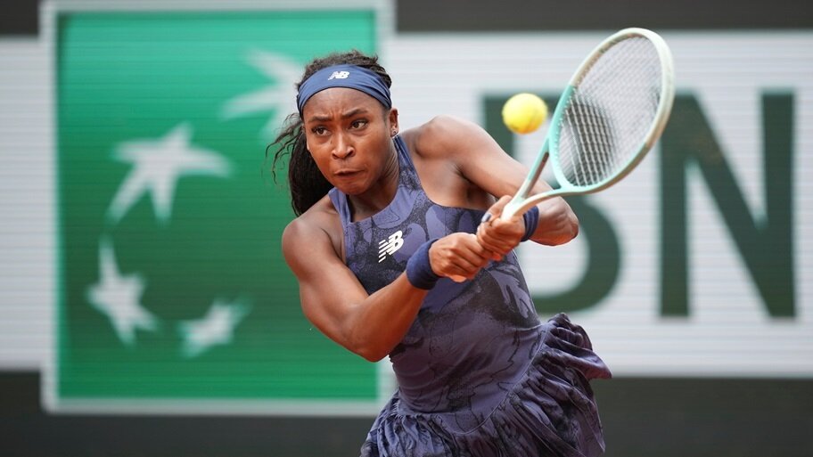 Coco Gauff returns a shot at the French Open.