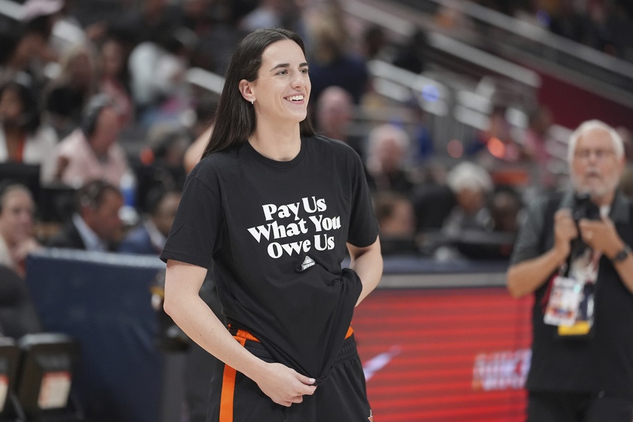 Caitlin Clark watches her teammates during the WNBA All-Star Game