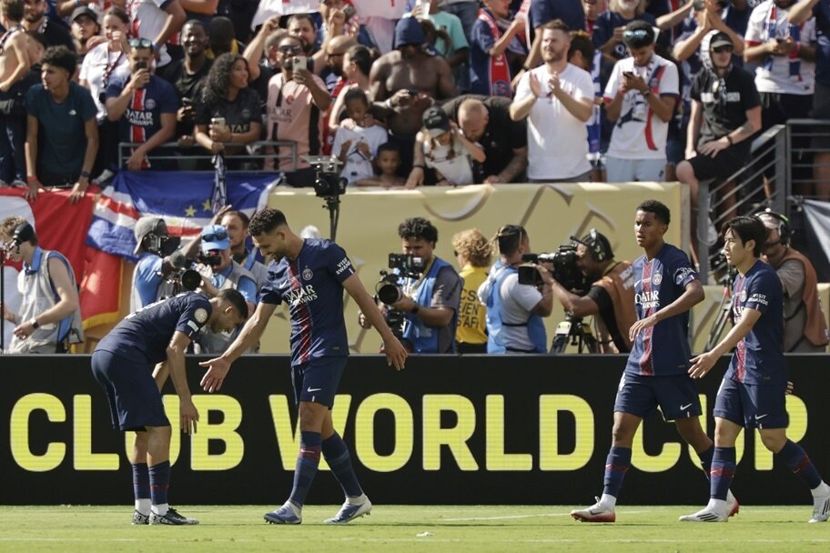 Paris Saint-Germain celebrate their win over Real Madrid at the Club World Cup.