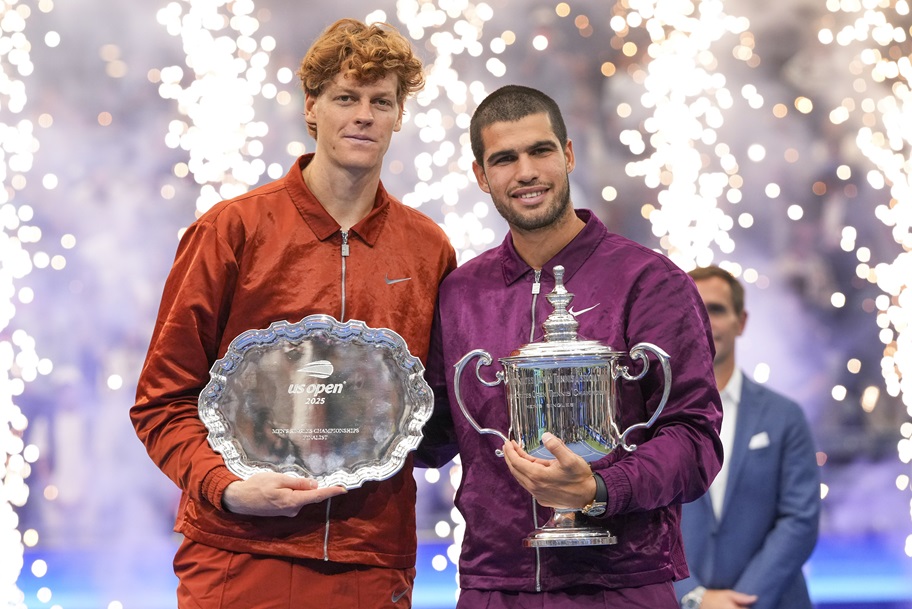 Carlos Alcaraz and Jannik Sinner pose after Alcaraz wins the 2025 US Open.