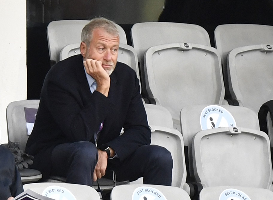 Former Chelsea owner Roman Abramovich watches a football match from the stands.