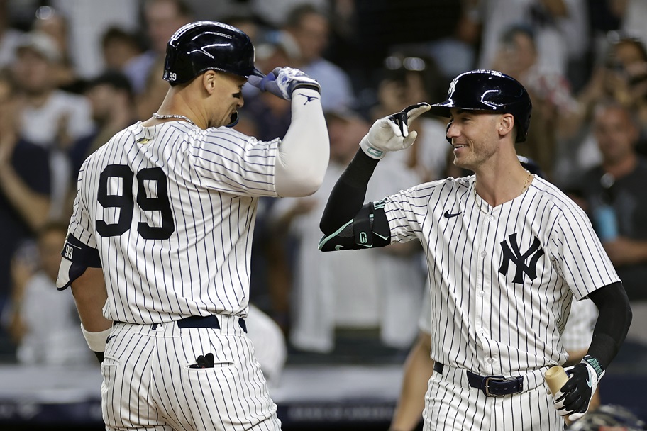 Cody Bellinger and Aaron Judge celebrate a home run.