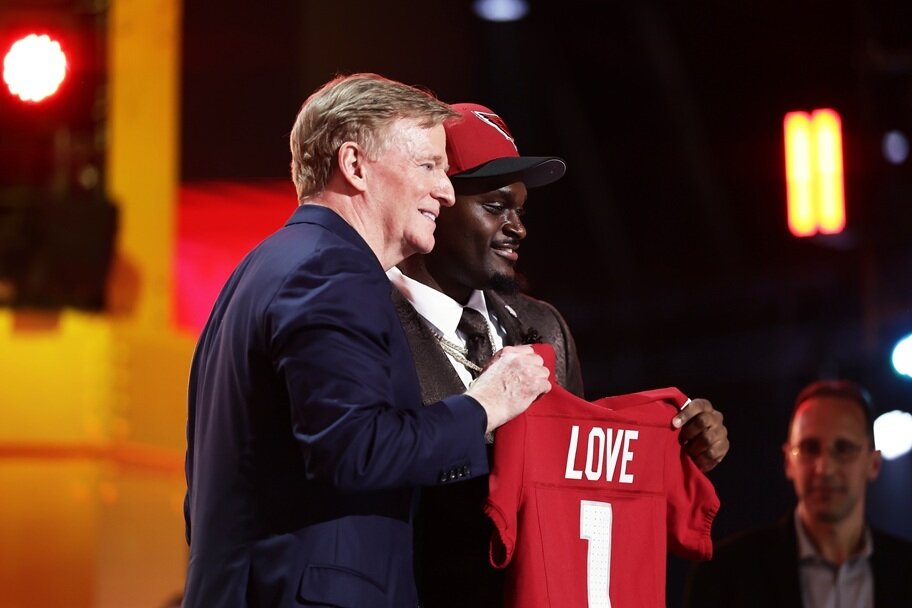 NFL commissioner Rogert Goodell and Jeremiyah Love pose during the NFL Draft.