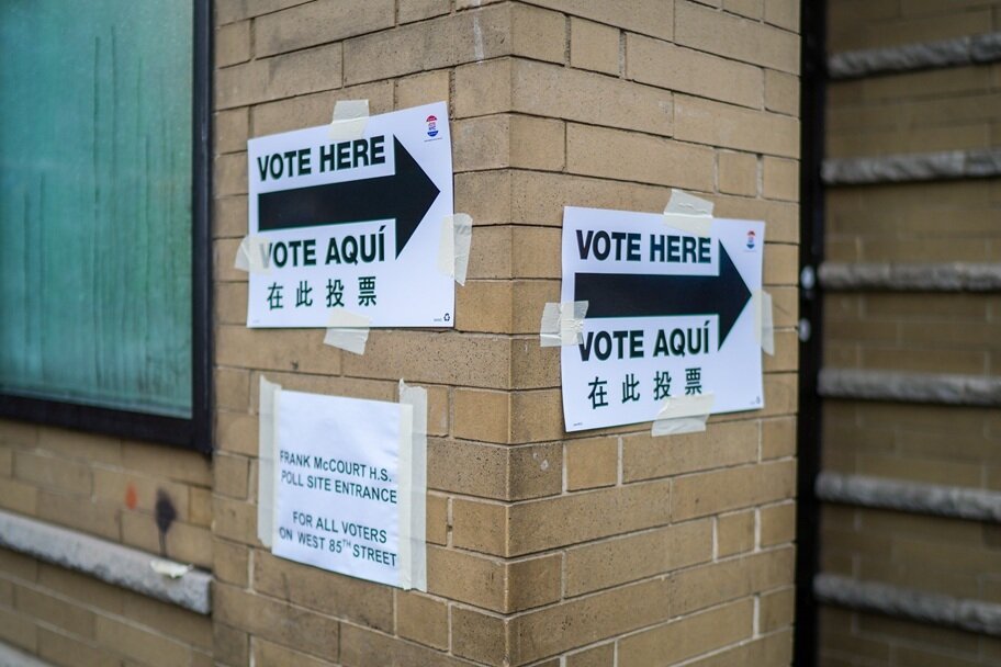 Voting signs are displayed in New York.